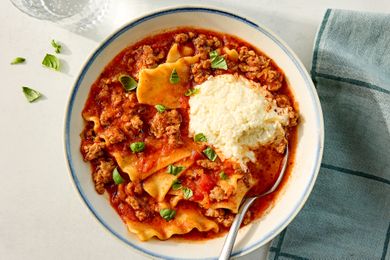 a bowl of Easy Lasagna Soup with a spoon