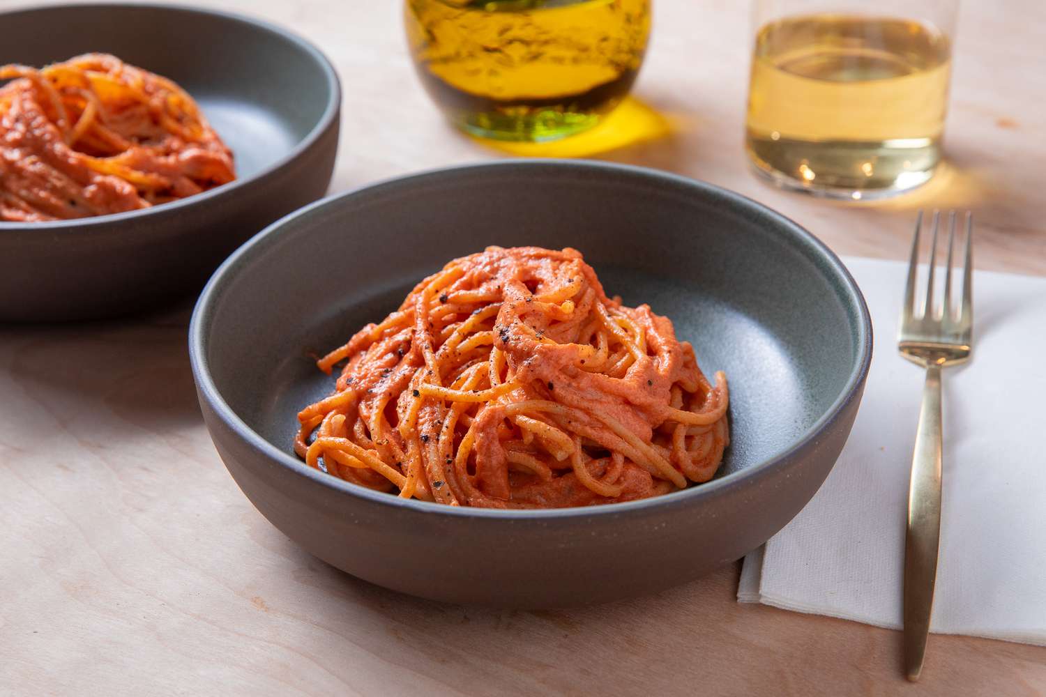 A bowl of spaghetti coated in red sauce