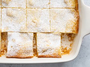 Gooey Butter Cake Cut into Pieces in a Baking Pan