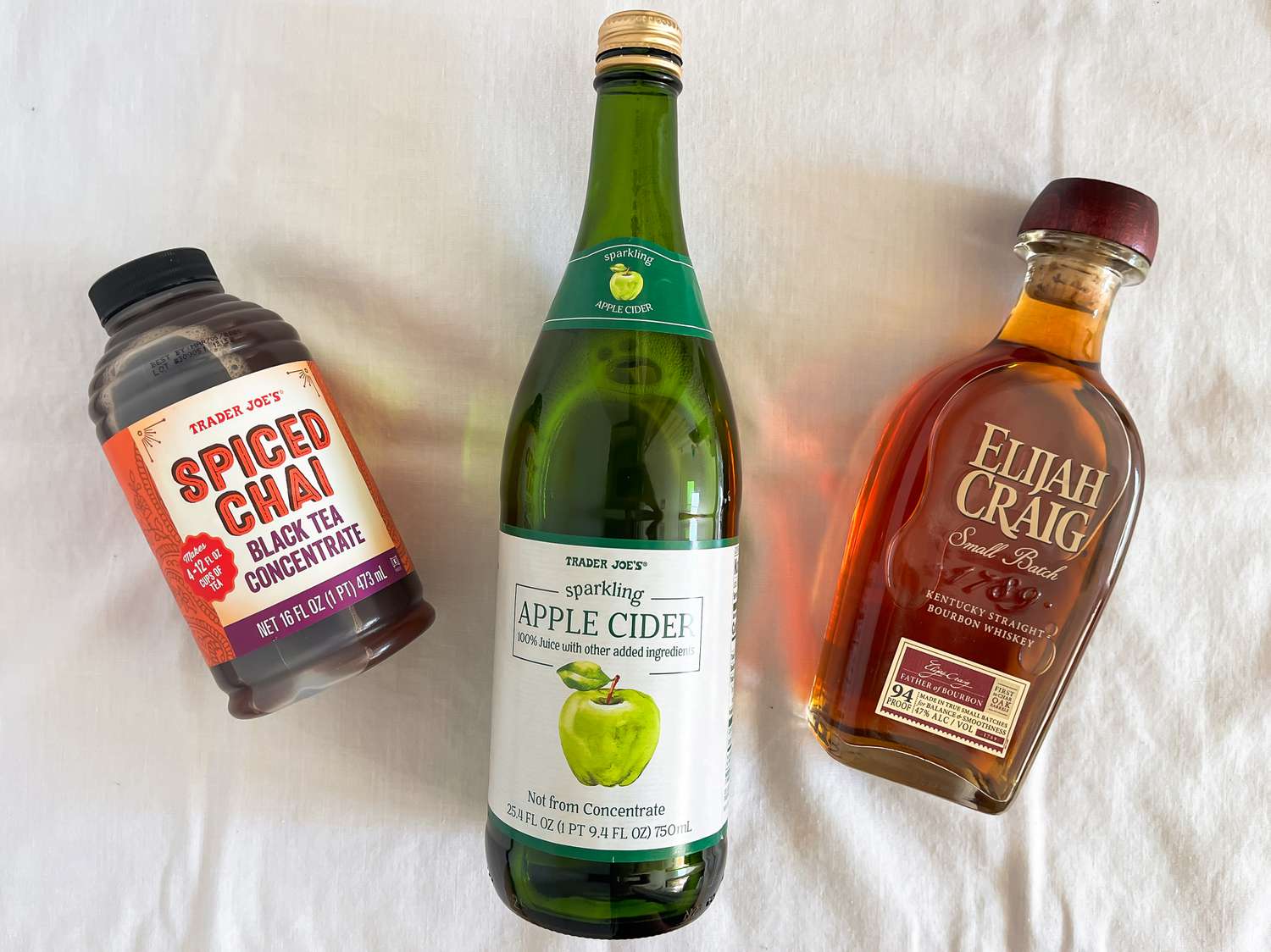 Thanksgiving cocktail ingredients (L to R): Spiced Chai Black Tea Concentrate, Sparkling Apple Cider, and Elijah Craig Bourbon