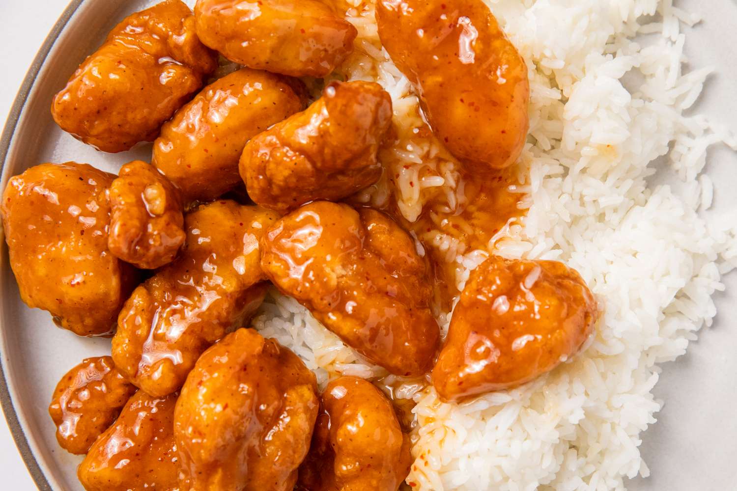 Plate with orange chicken and white rice a simple meal serving