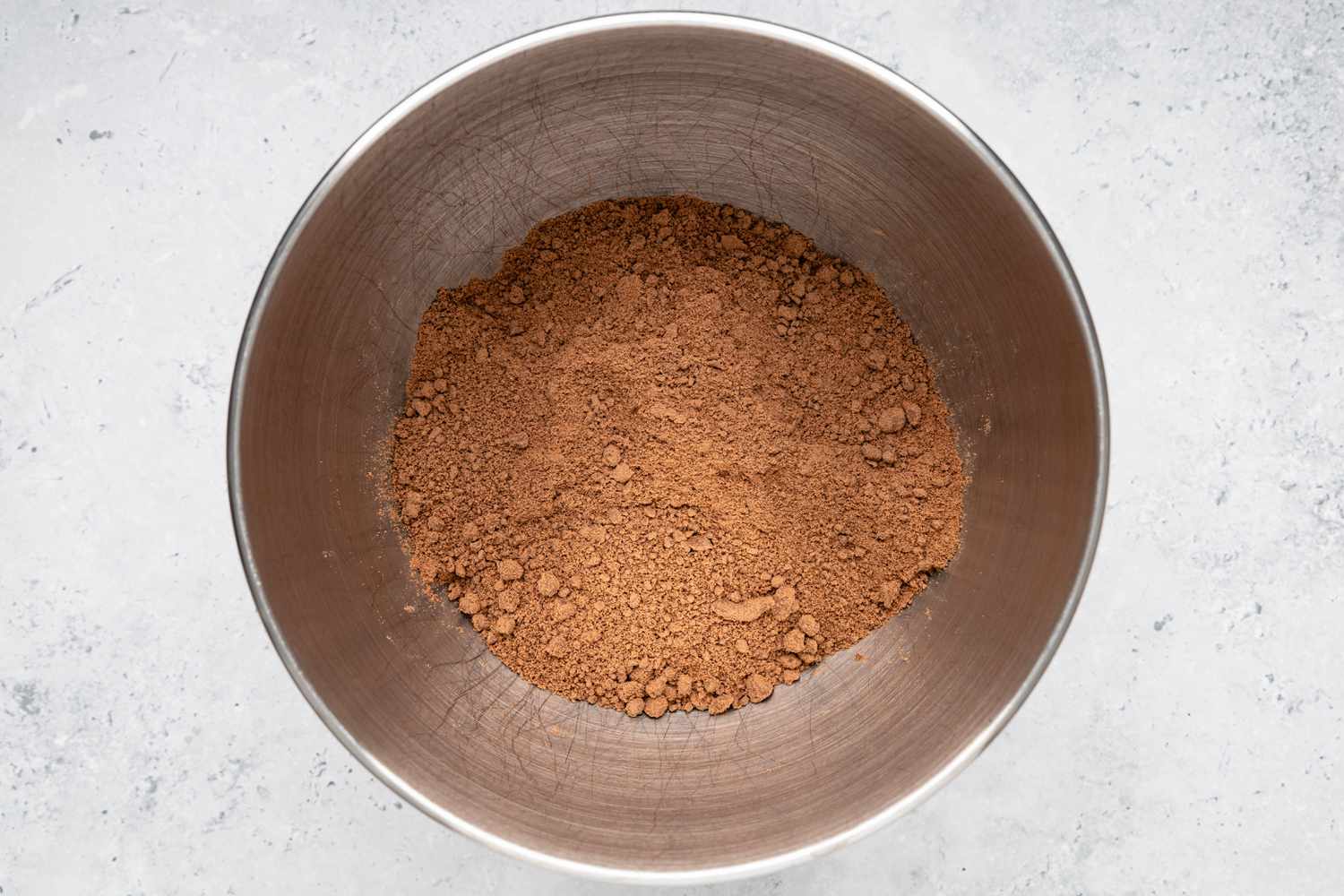 Cocoa Powder and Creamed Butter Mixture in a Mixer Bowl for Easy Chocolate Buttercream Frosting