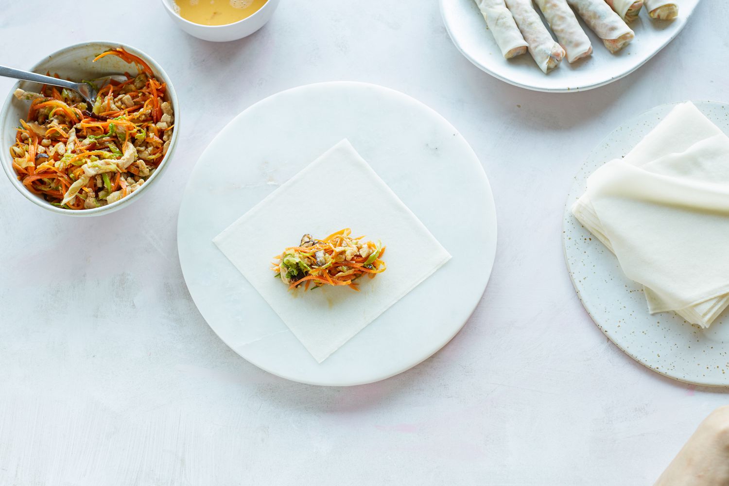 Filling spring roll wrappers to make fried spring rolls.