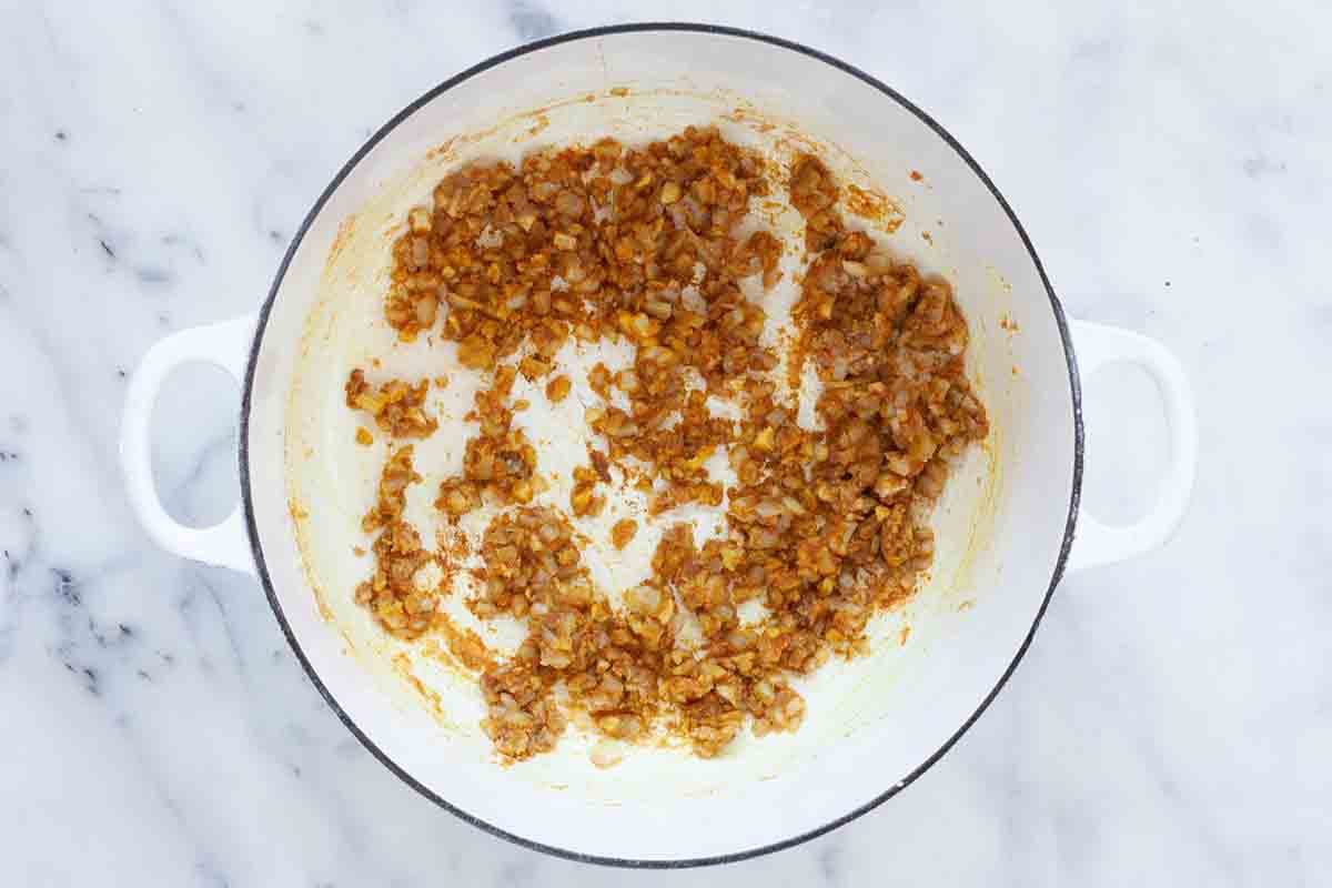 Chicken stew with harissa cook the onion and garlic