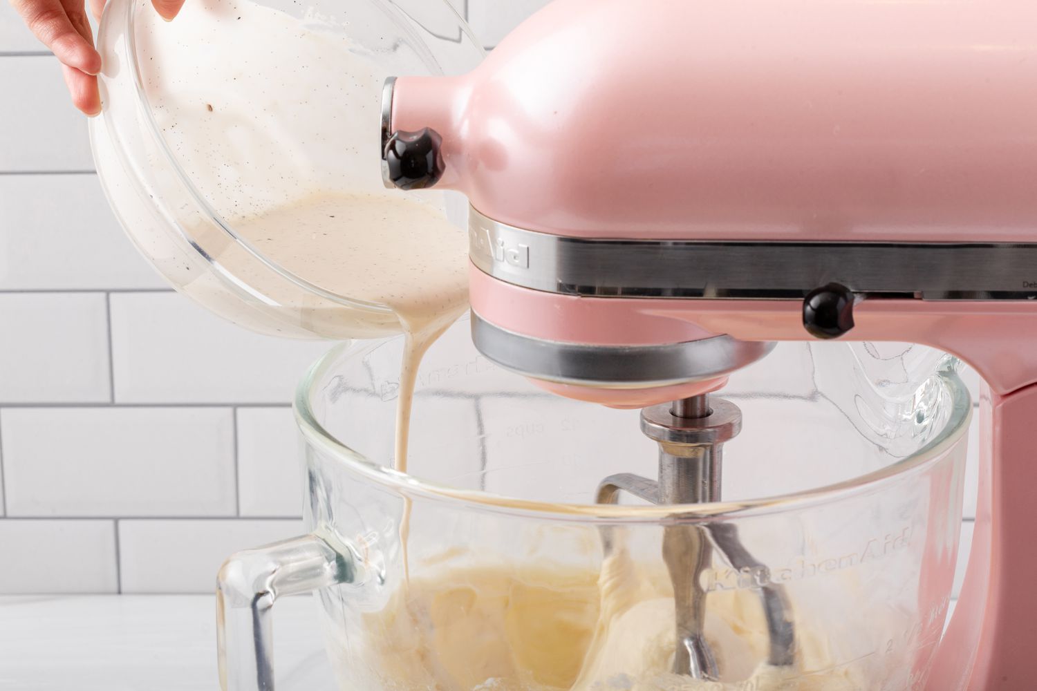 Adding vanilla cream to make the best vanilla cupcake recipe.