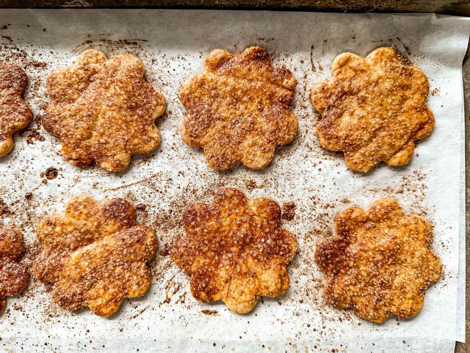 Baked flowershaped pie crusts on a baking sheet