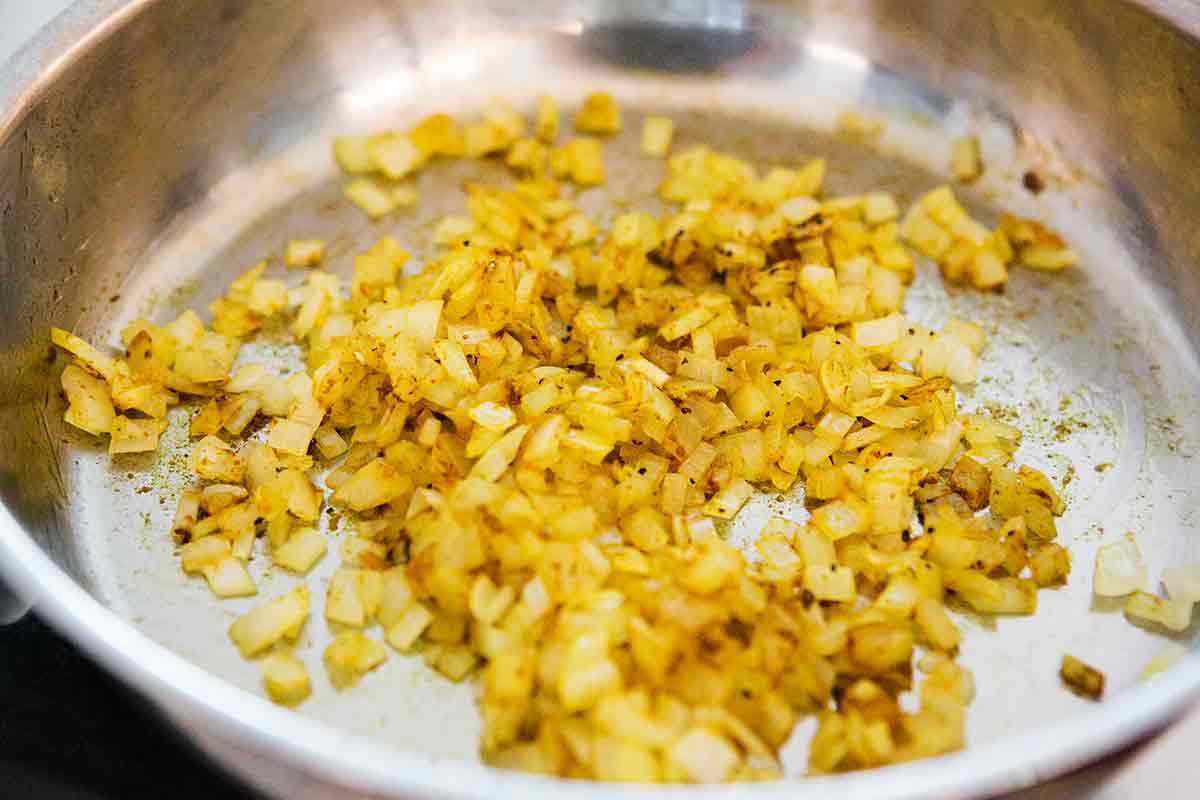 sauteed onions and curry in saucepan for shrimp curry 
