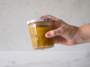 Vigorously shake jar of Italian dressing.