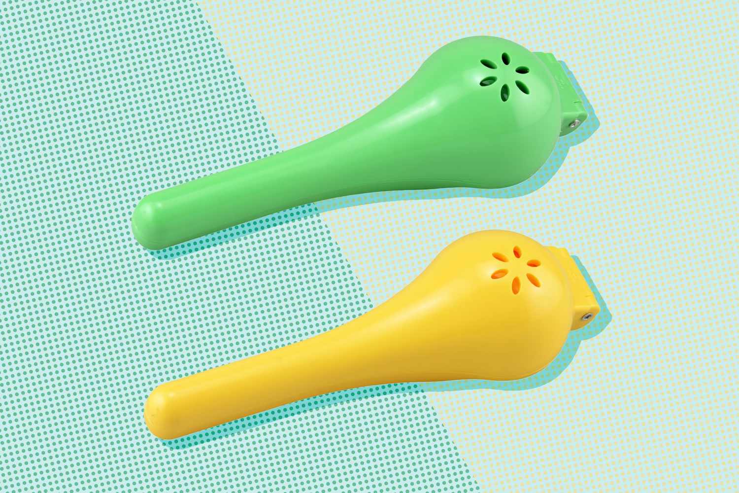 Two plastic kitchen tools one green and one yellow with holes for ventilation or dispensing purposes