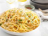 Spaghetti Aglio e Olio (Pasta With Garlic and Oil) Topped with Herbs and Parmesan