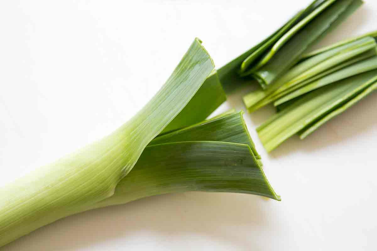 cut dark green tops off of leeks