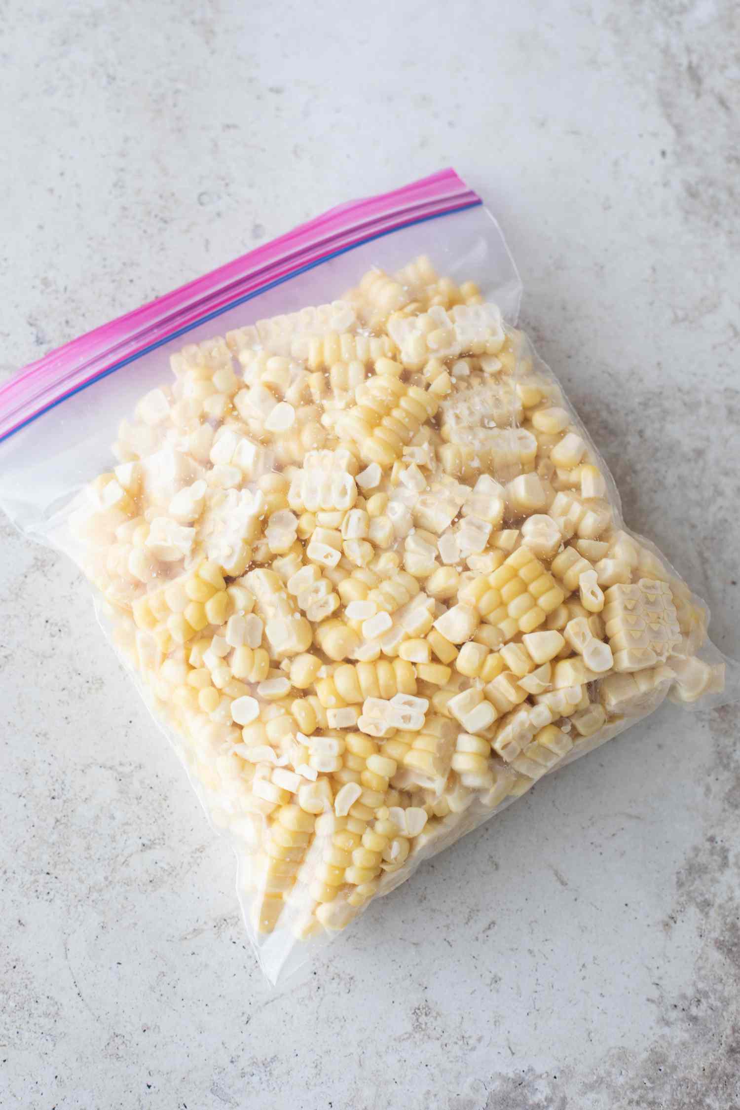 Corn kernels in a ziptop plastic bag ready for freezing