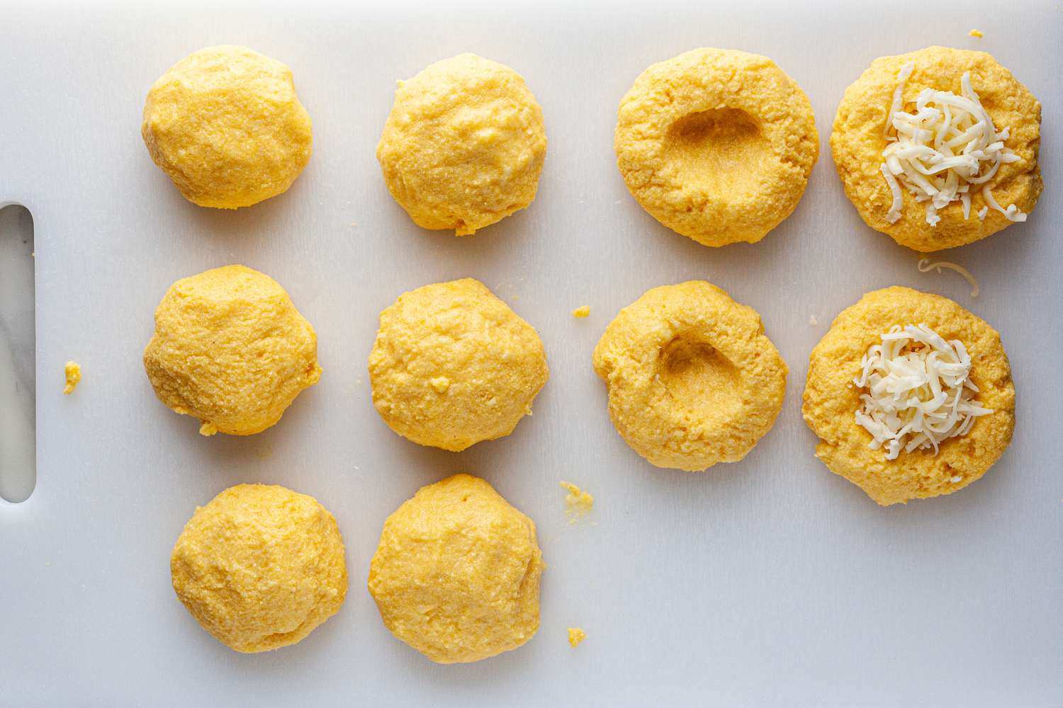 Roll arepa dough into balls.