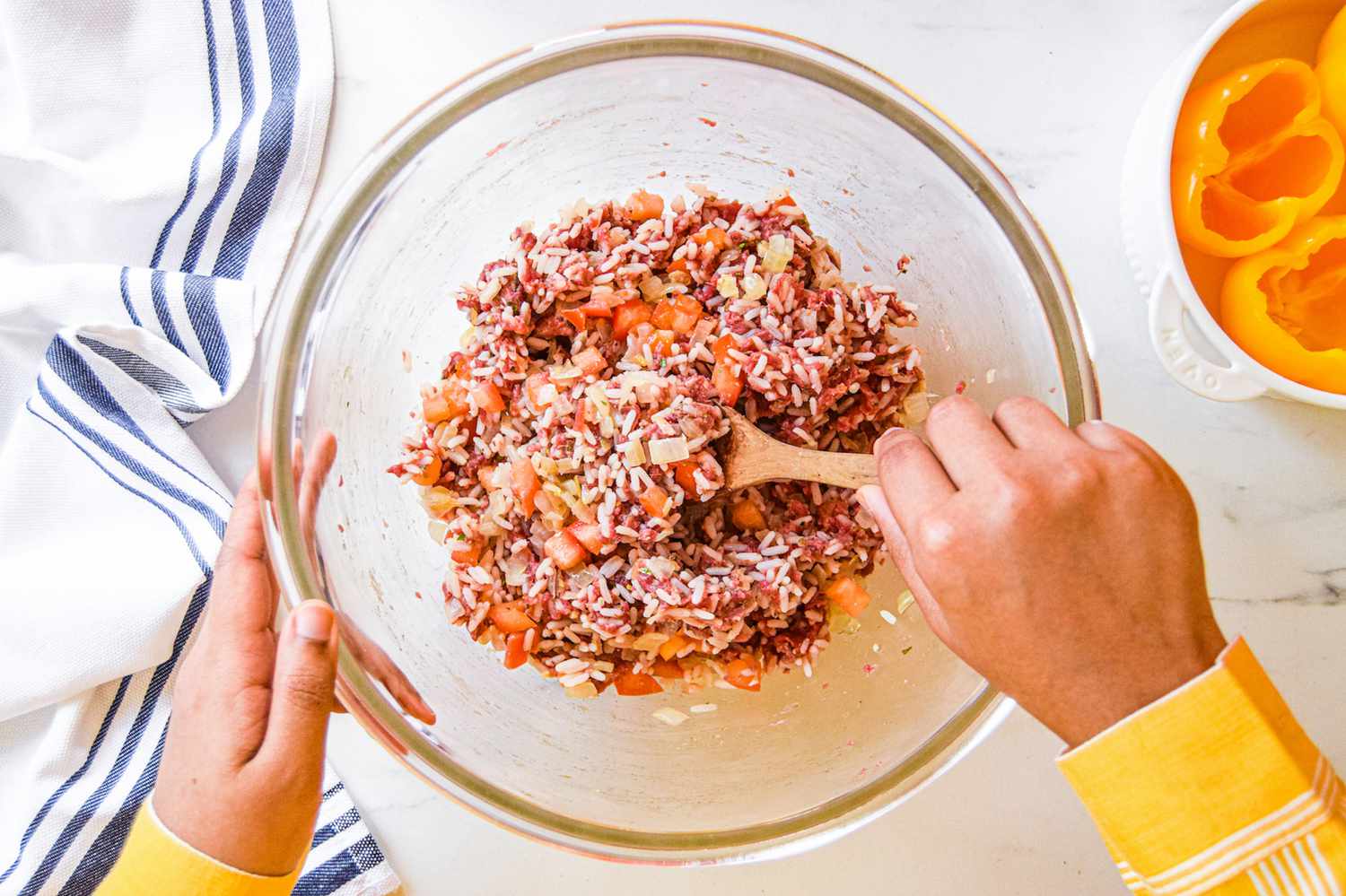 Mixing the filling for a stuffed pepper recipe.