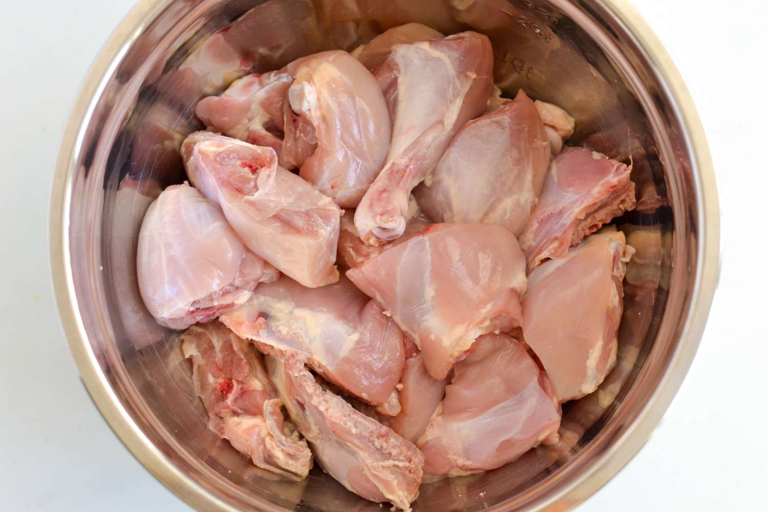 Uncooked Chicken Legg and Thigh in a Bowl for Guyanese Chicken Curry