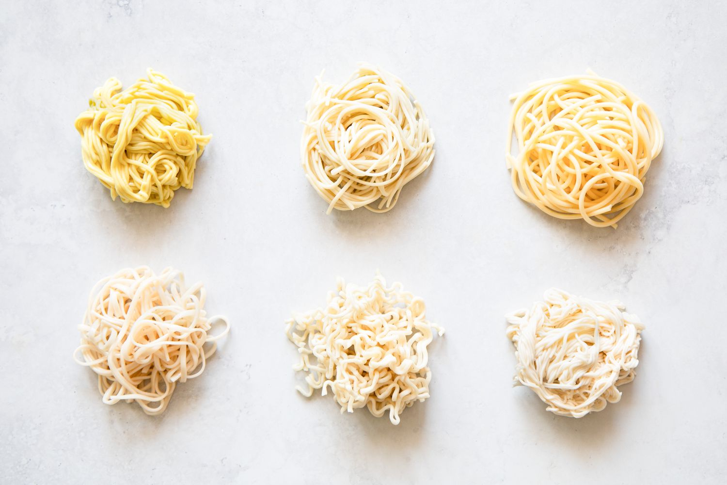 Different Types of Wheat Noodles Wrapped Into Little Bundles on the Counter