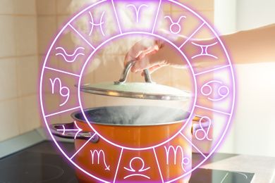 A hand lifting a pot lid while surrounded by a translucent astrology wheel overlay