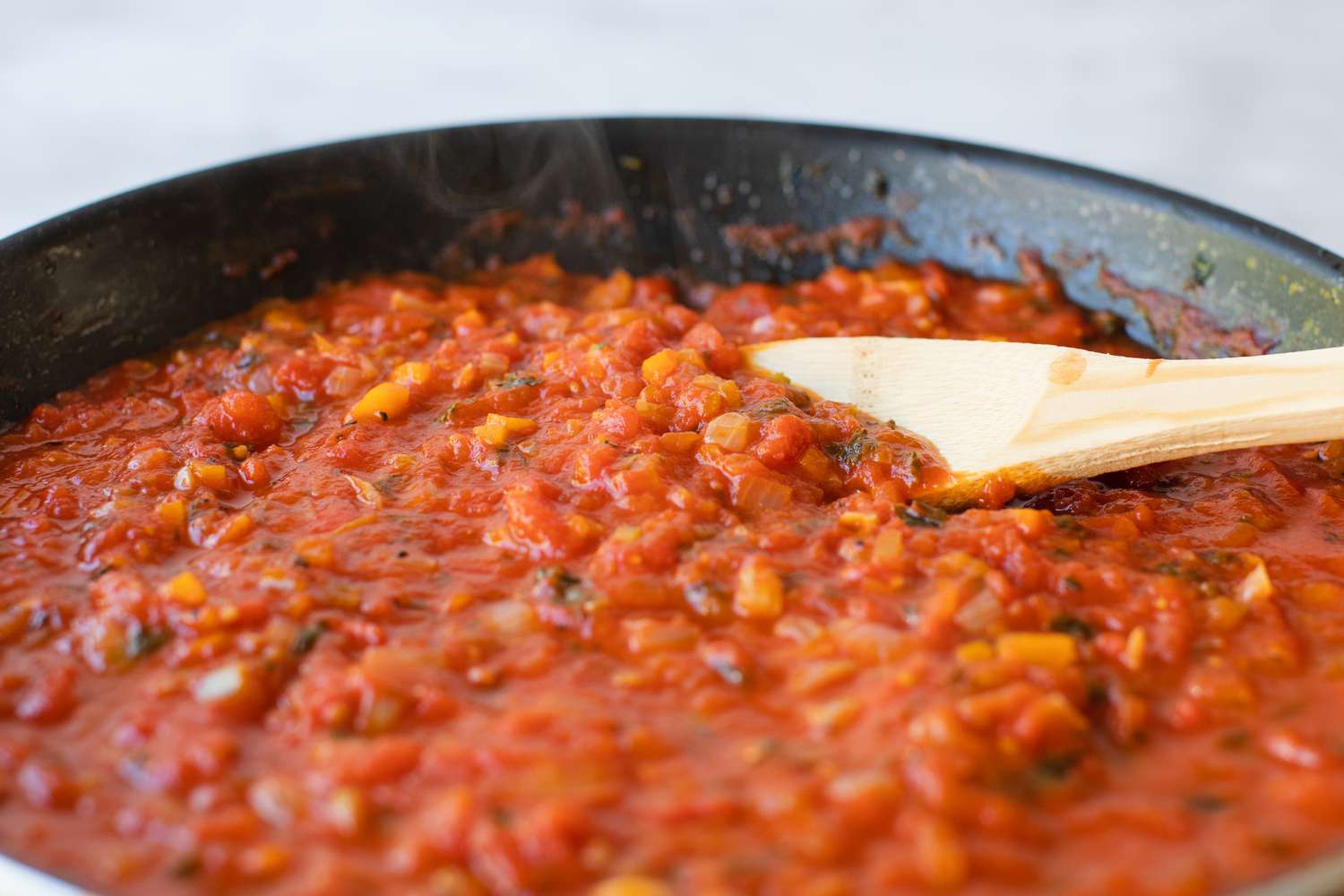 Homemade marinara Sauce simmering in a pan