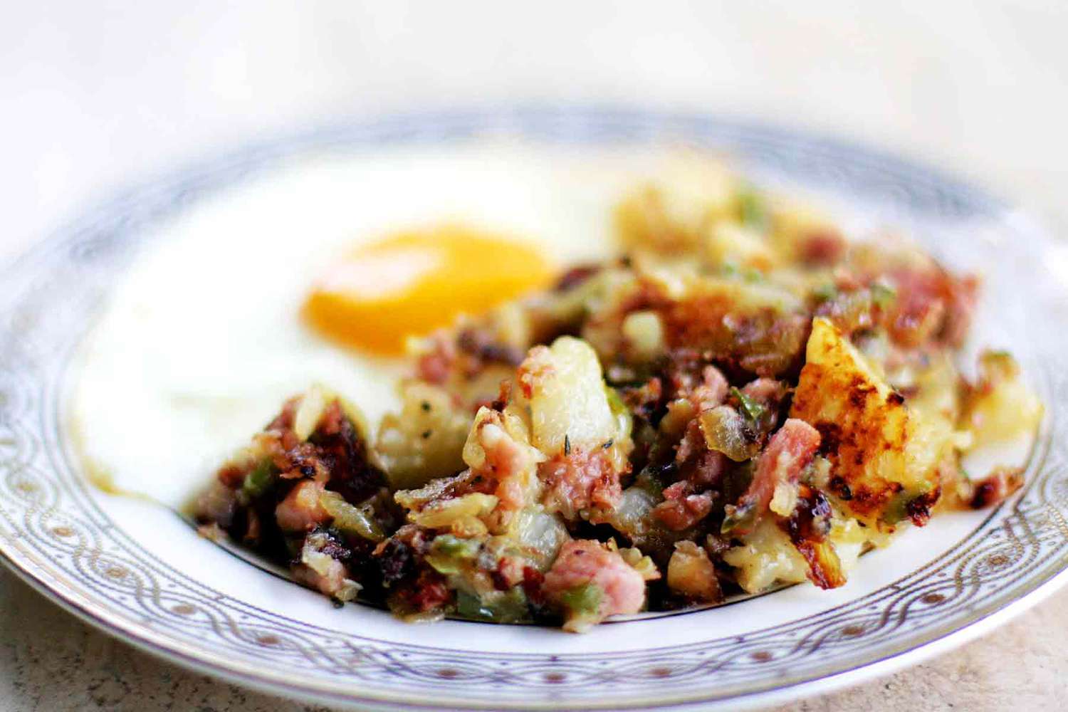 ham and potato hash with a fried egg