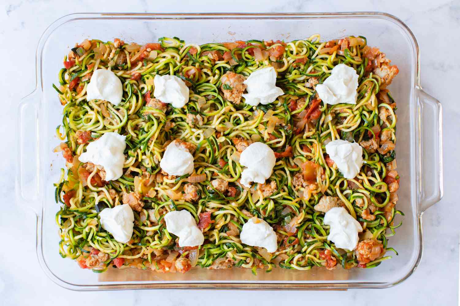 Zucchini Noodle Casserole Topped with Ricotta