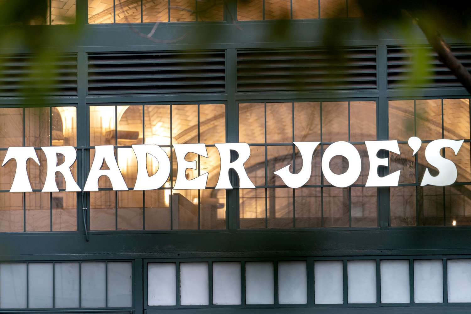 Trader Joe's sign on a storefront window and entryway