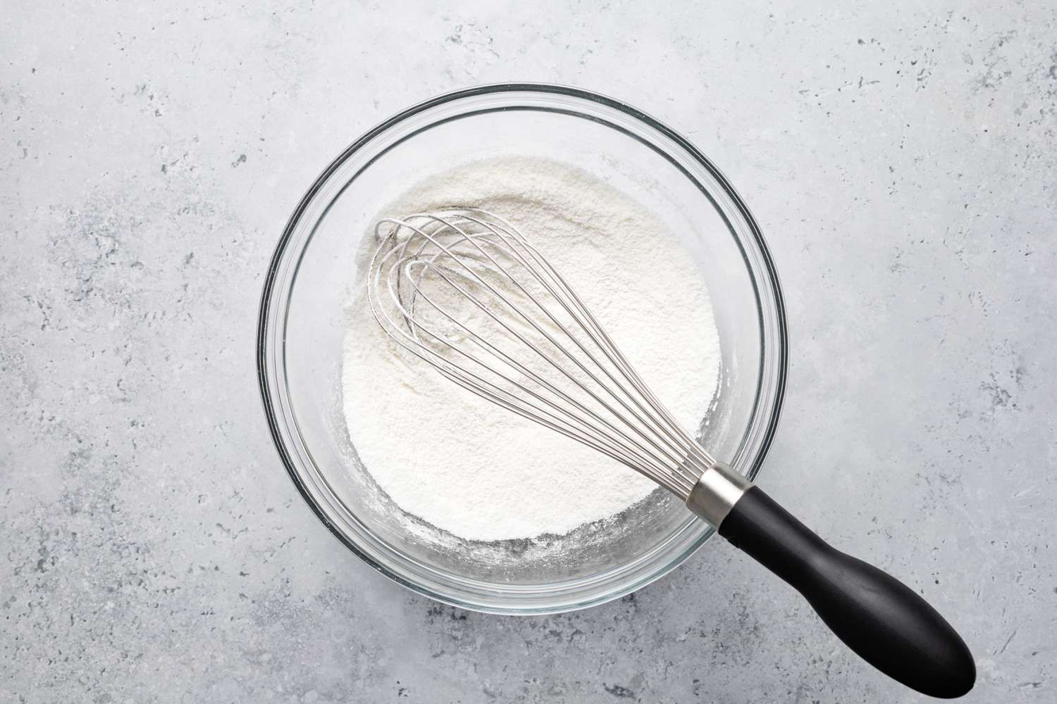 Dry Ingredients for Vanilla Custard in Bowl with a Whisk