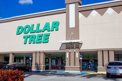 Exterior of a Dollar Tree store with parked cars in front
