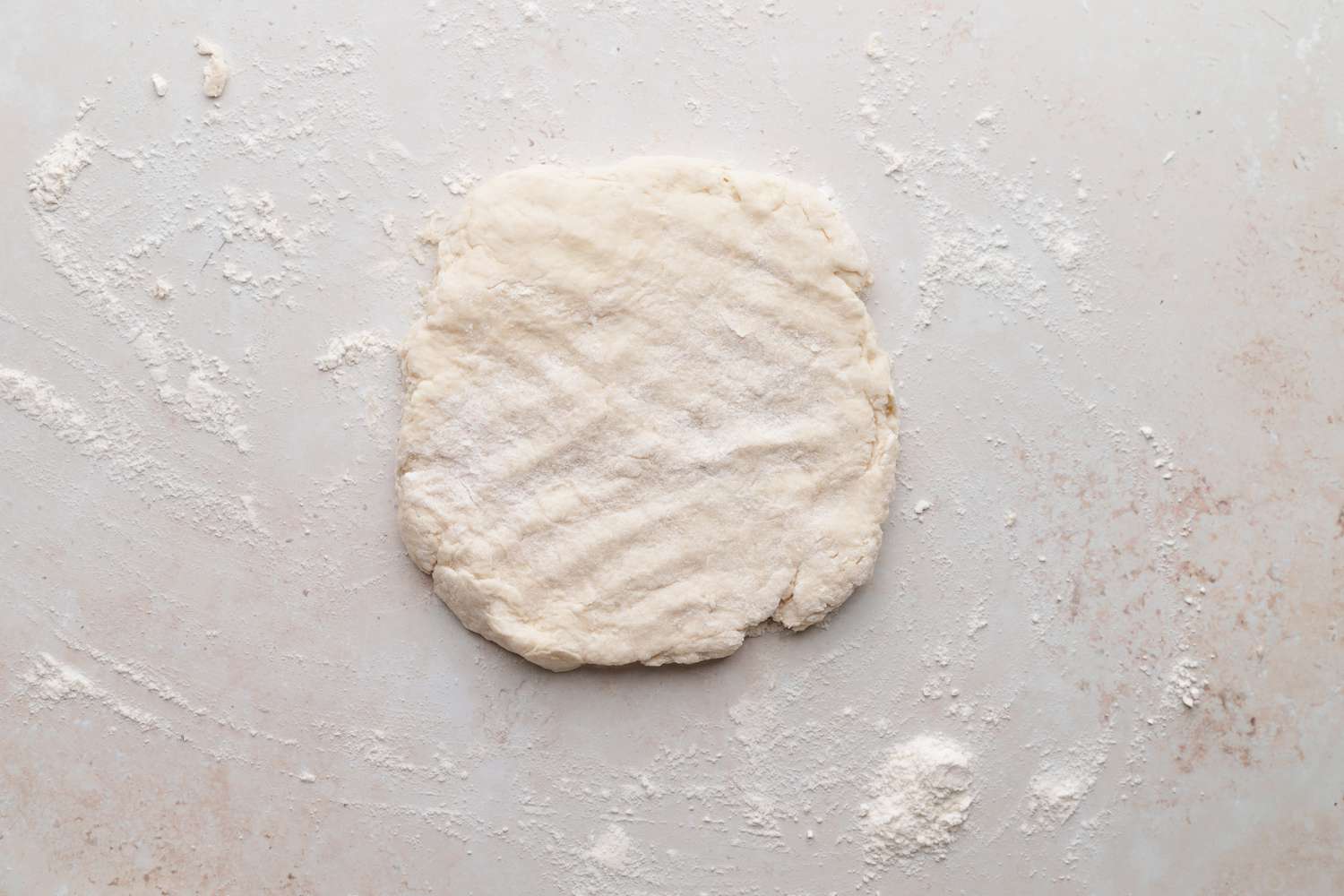 Biscuit dough on a counter to make homemade biscuits and gravy