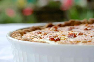 Ham and Asparagus Quiche in white dish
