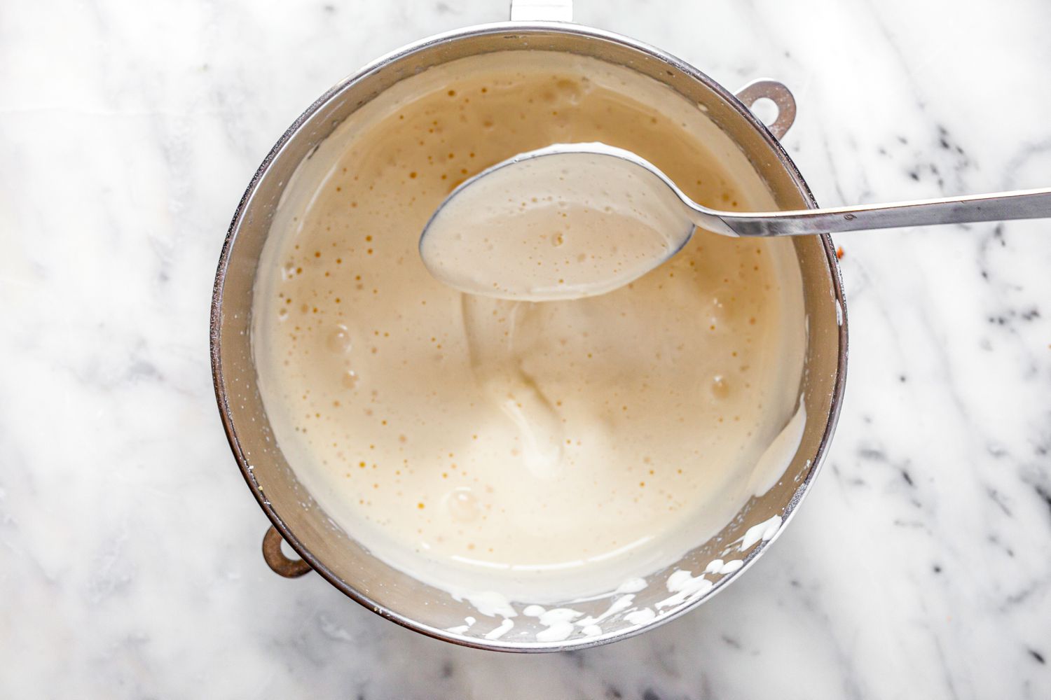 Dry Ingredients Folded into Wet Ingredients Using a Spoon for Victoria Sponge Cake