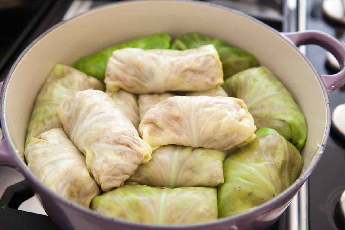 add the stuffed cabbage rolls on top of the sauerkraut