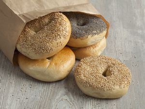 a paper bag of bagels