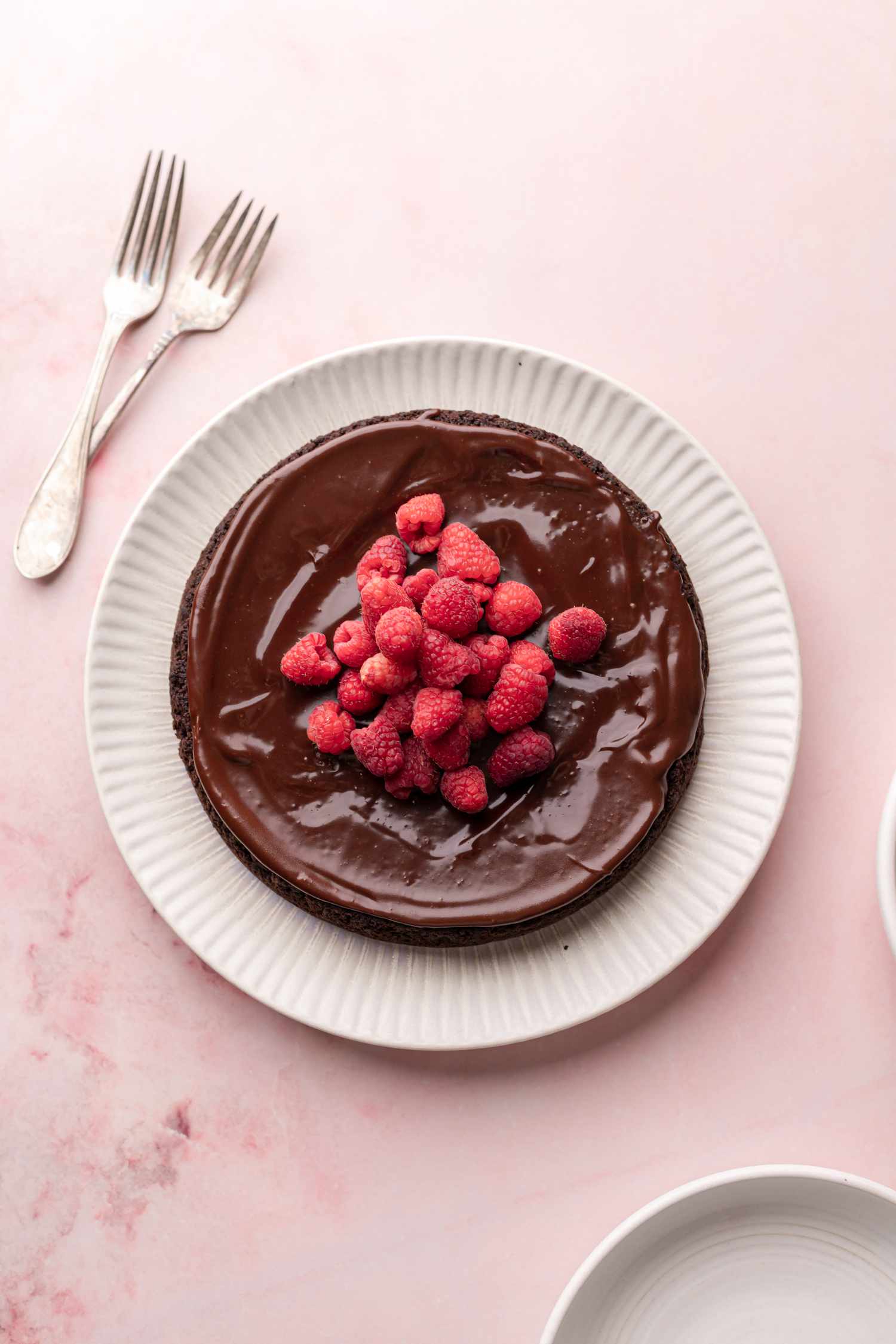 Flourless Chocolate Cake Garnished with Fresh Raspberries 