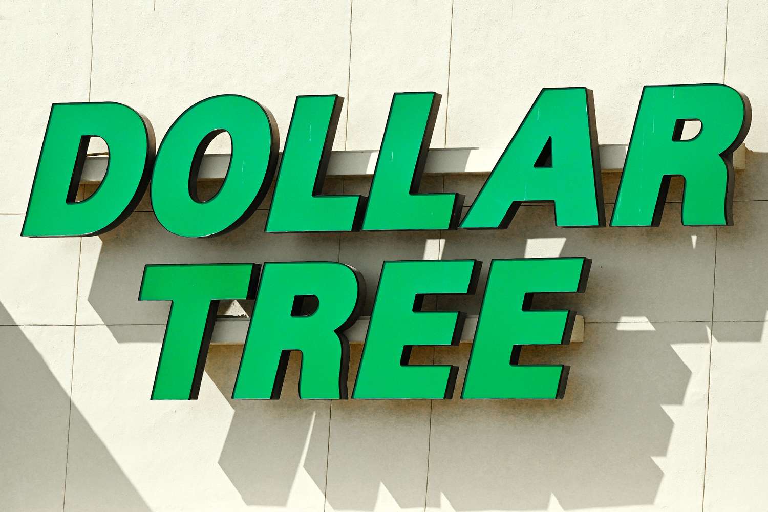 Dollar Tree storefront sign on a beige wall