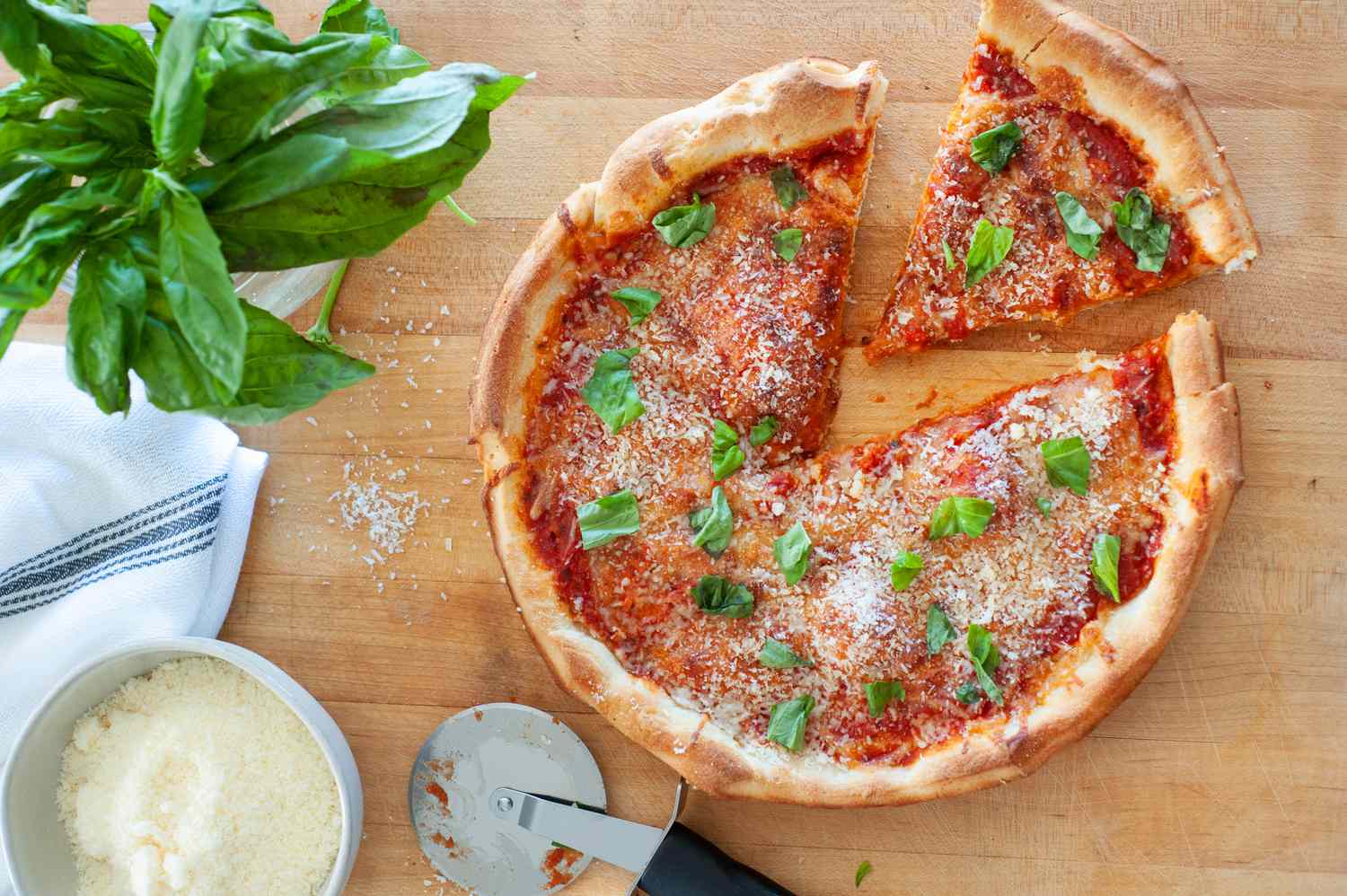 Slice of pizza cut from cast iron pizza.