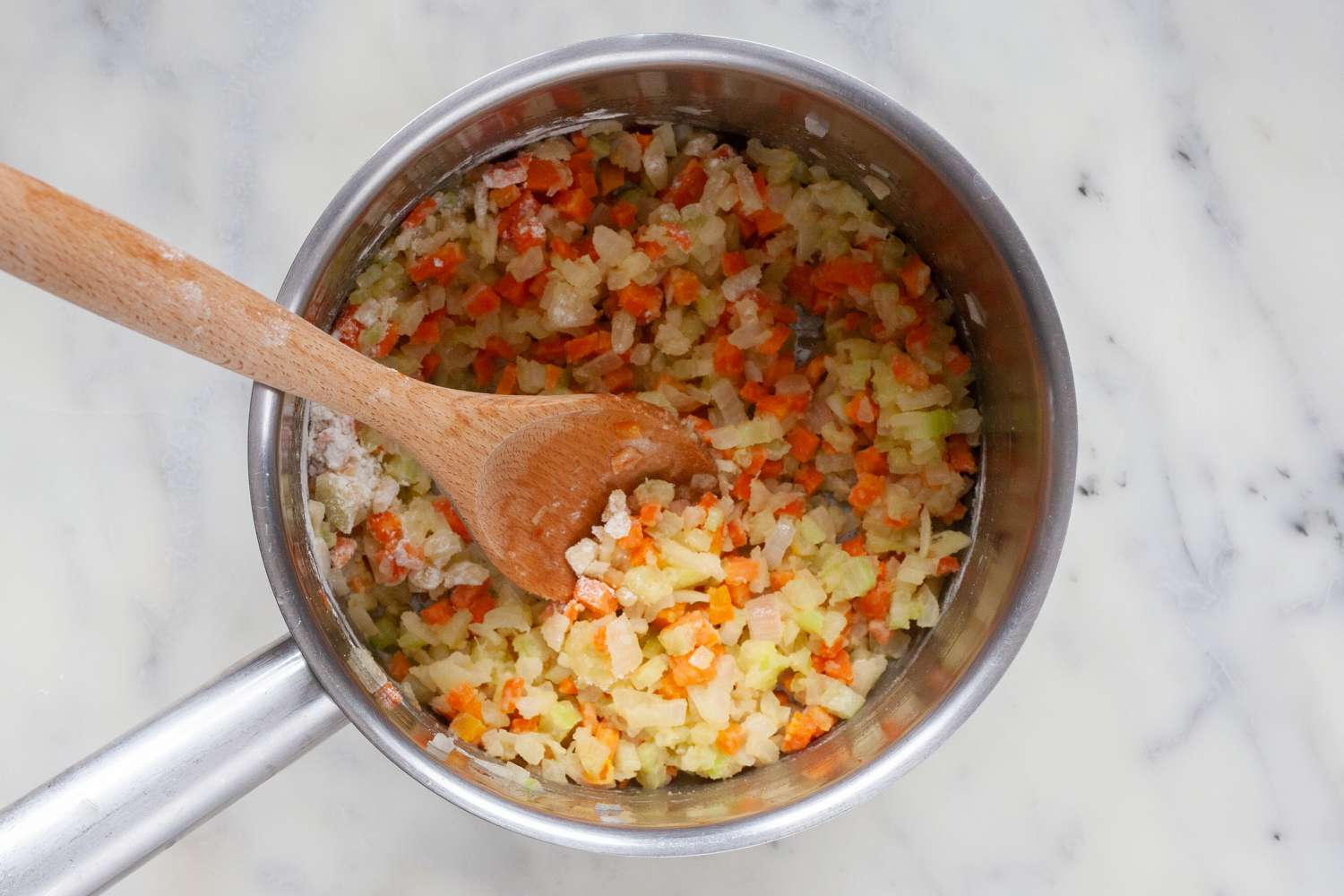 Flour added to onions, celery, and carrots for classic espagnole sauce