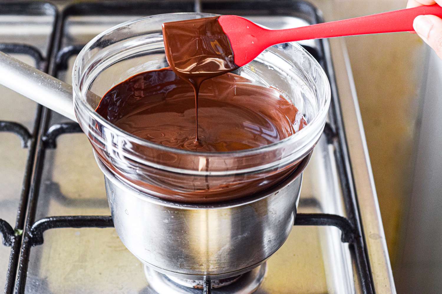Smoothly melted chocolate ready to add to Chocolate Bourbon Cake