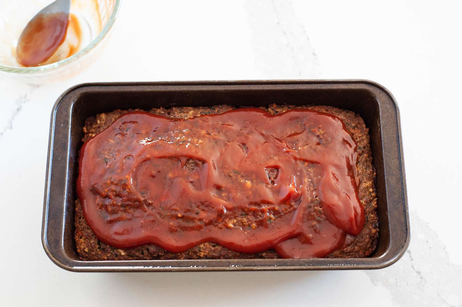 Vegetarian Meatloaf Topped with Sauce