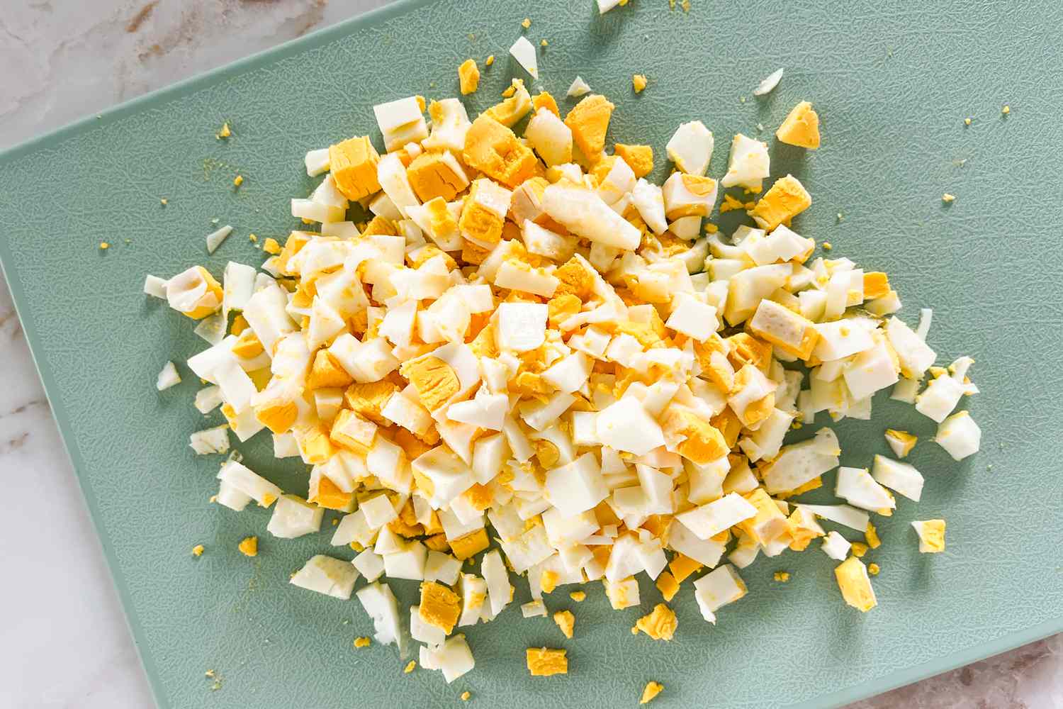 chopped eggs on a cutting board