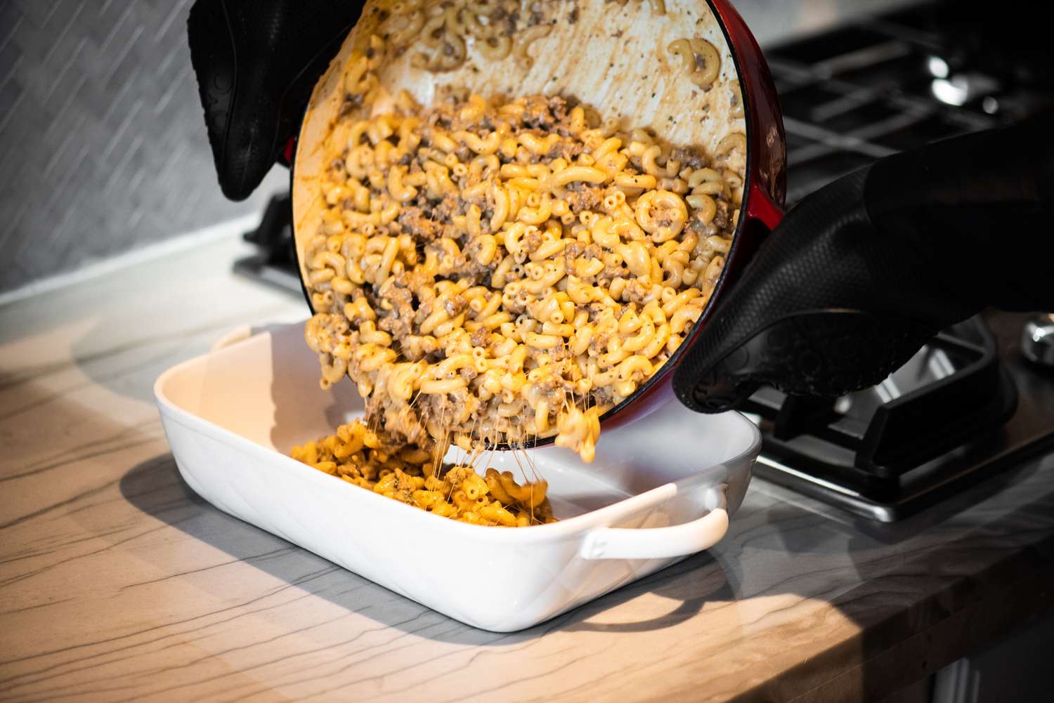 Cheeseburger Casserole Ingredients Poured into a Casserole Dish