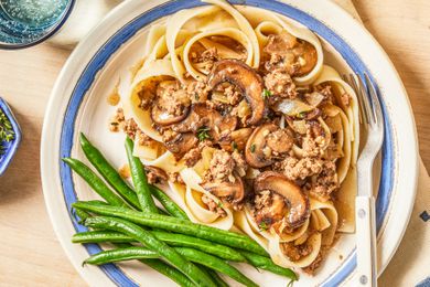salisbury ground beef with a side of green beans on a plate
