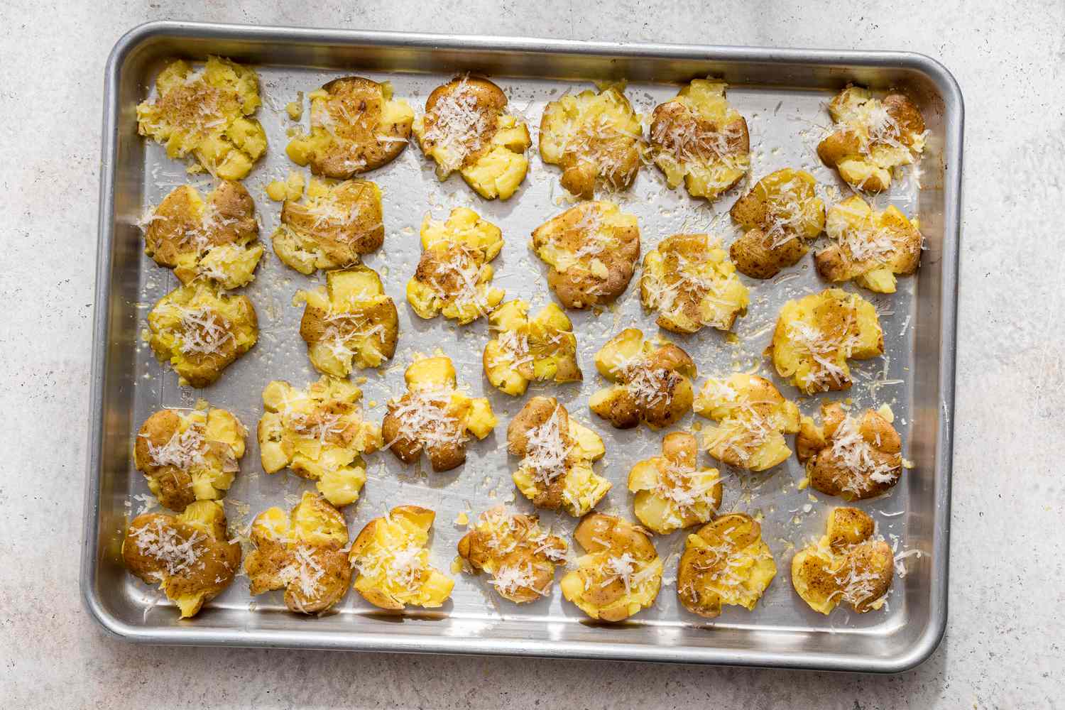 Smashed potatoes topped with parmesan for Australian crash hot potatoes recipe