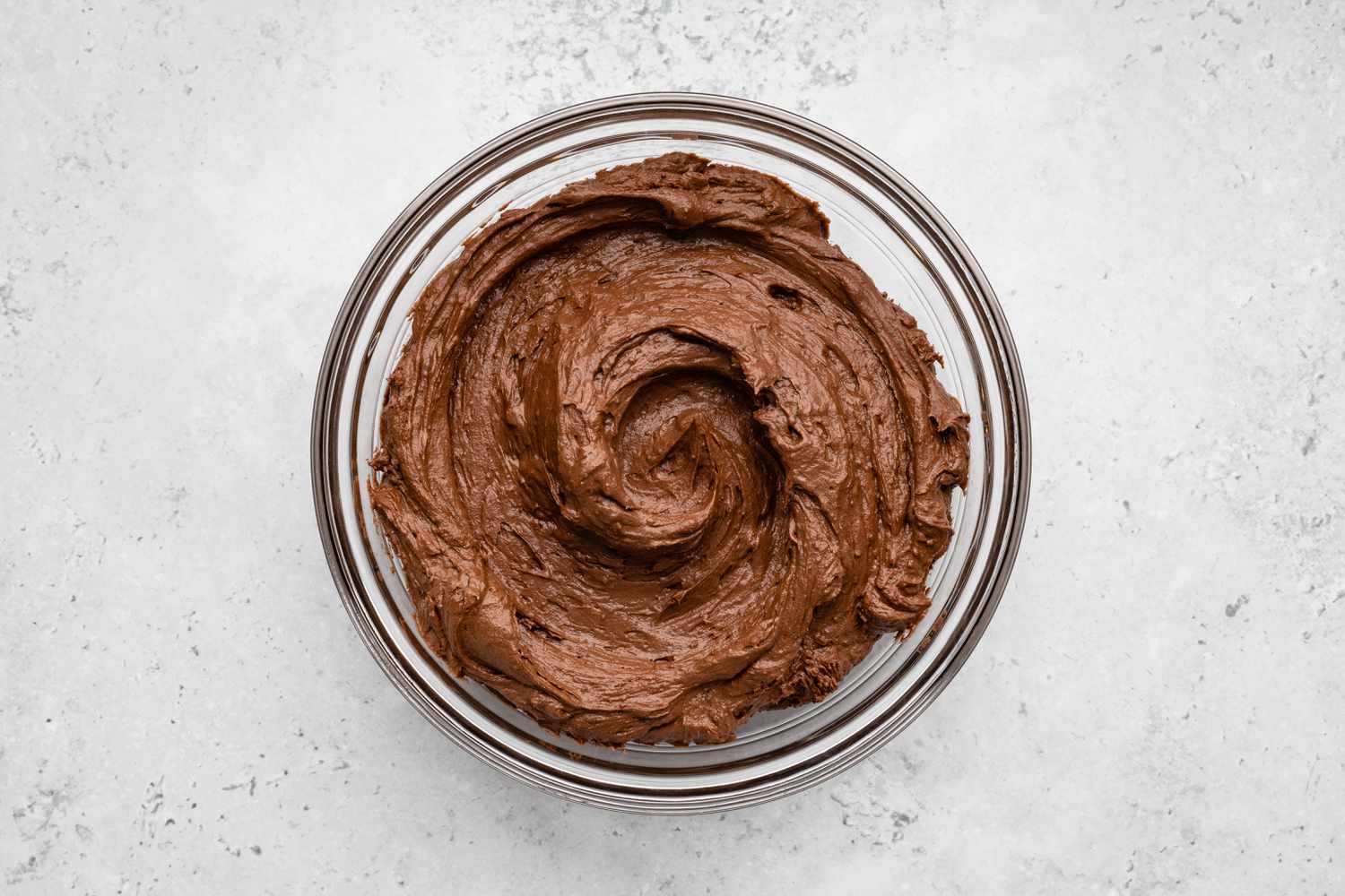 Bowl of Easy Chocolate Buttercream Frosting for One-Bowl Double-Layer Chocolate Cake Recipe