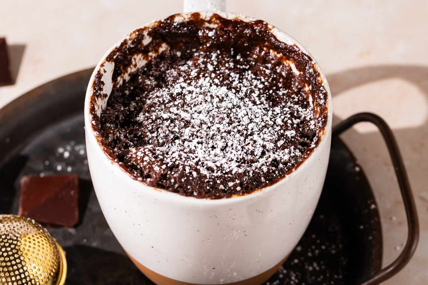 chocolate mug cake on a tray 