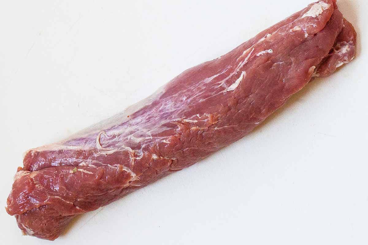 preparing meat for bacon wrapped pork loin