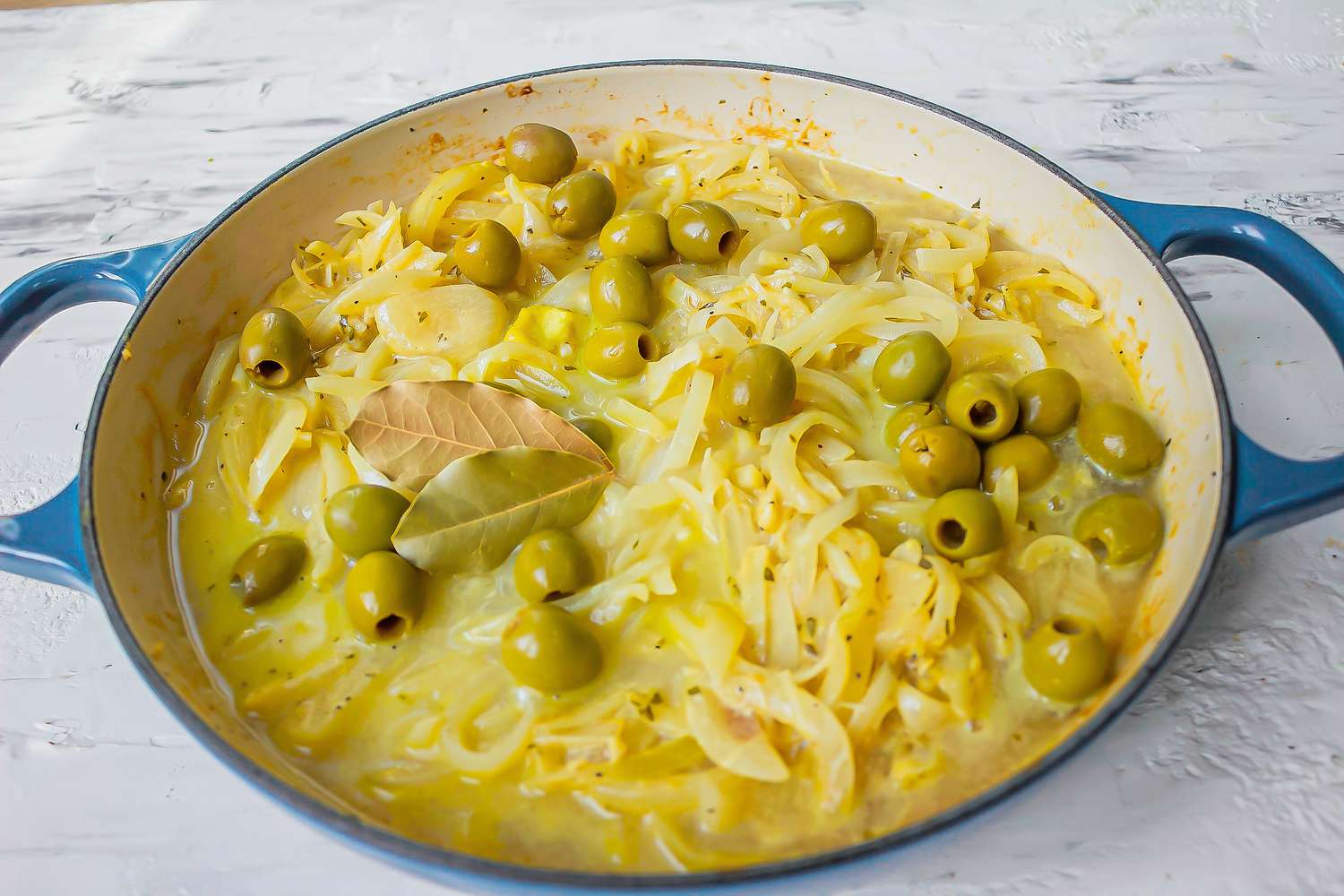 Cooking onions for chicken yassa recipe