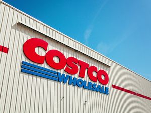 The exterior of a Costco Wholesale storefront featuring the companys logo