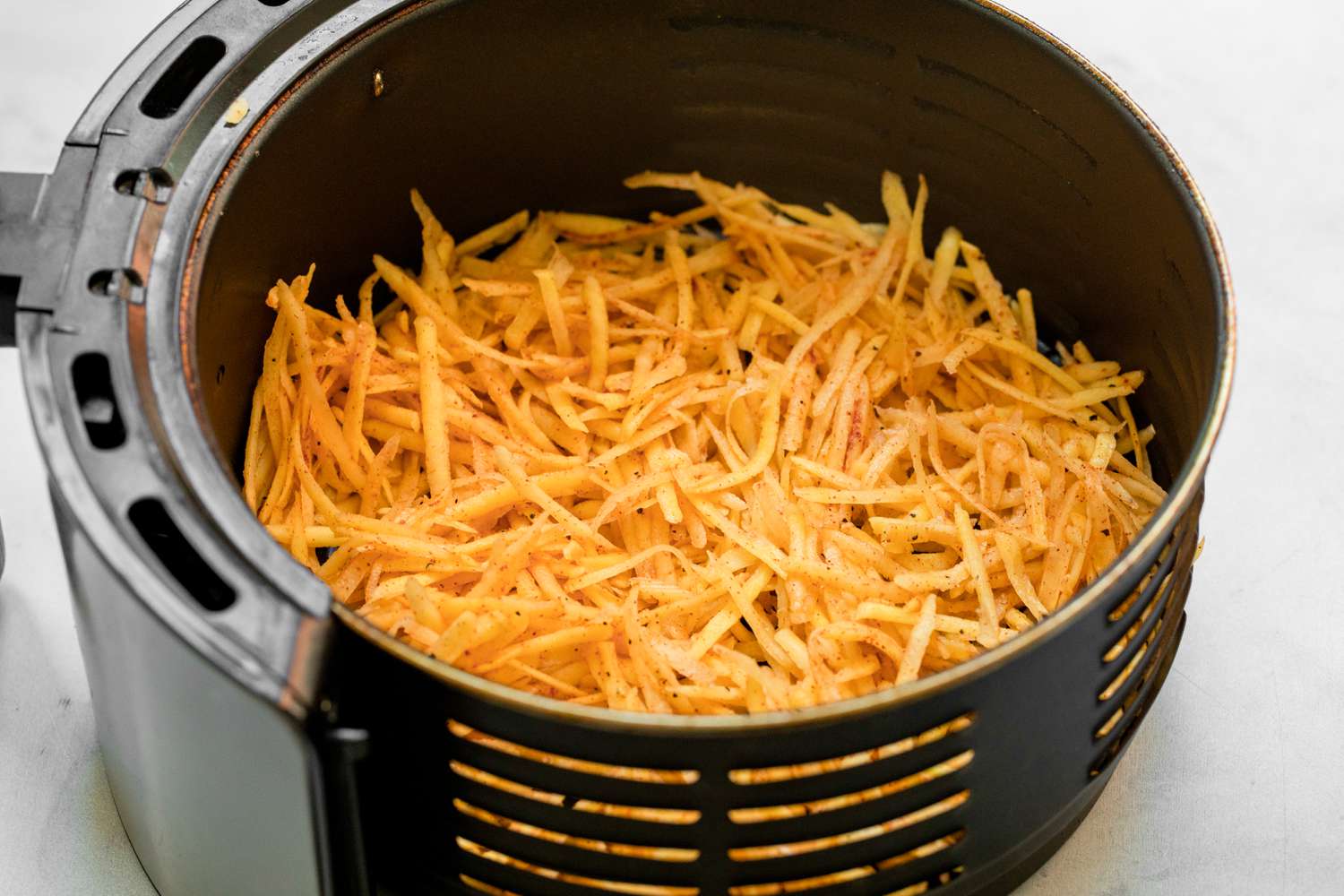 Air Fryer Hash Browns in Air Fryer Basin