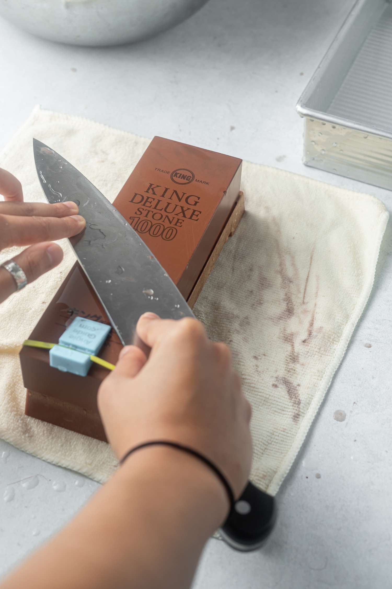 Sharpening a knife on a sharpening stone or whetstone