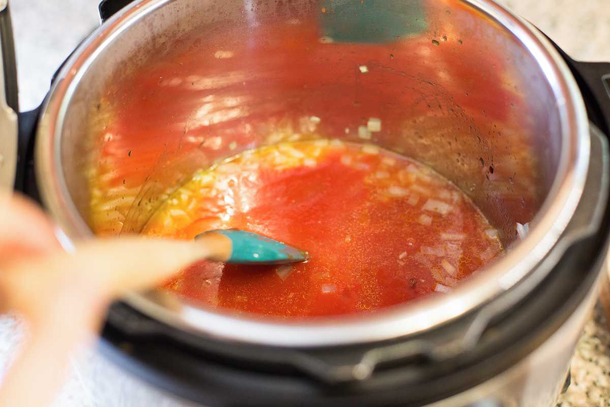 Sauce for meatballs instant pot mixed in the pot.